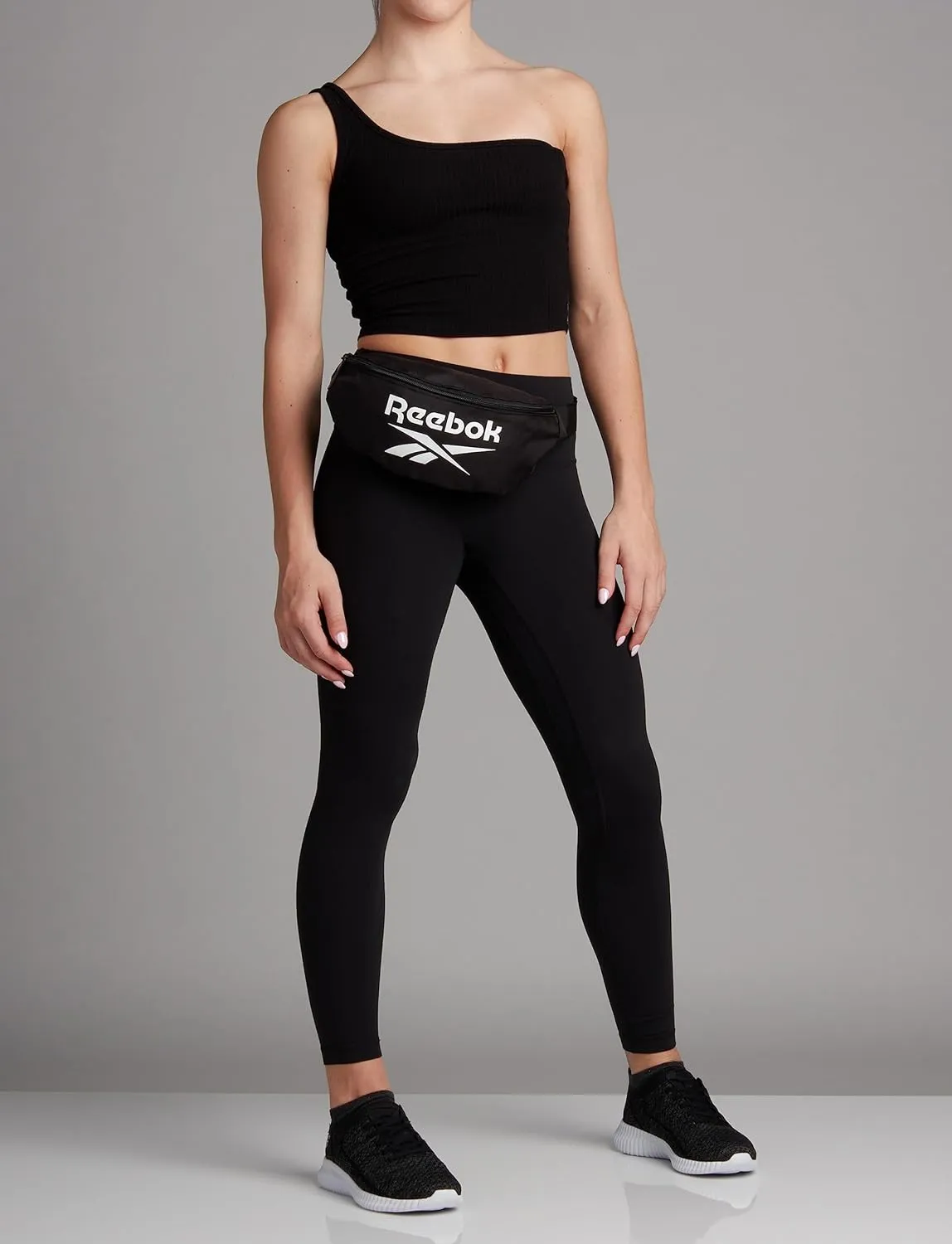 Reebok Waist Belt Fanny Pack - Stylish Fashion Cross Body and Waist Belt Bags - Lightweight Crossbody Bags for Women and Men, Solid Black With White Logo